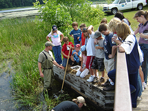 people around their local pond with instructors